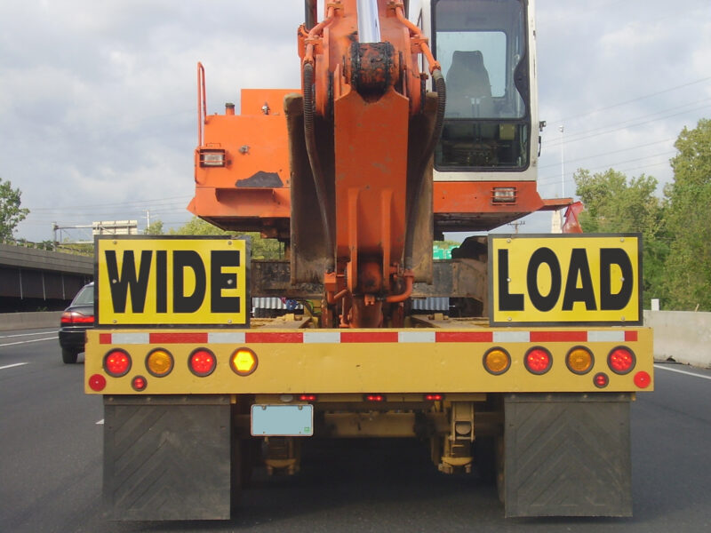 sign on back of construction equipment